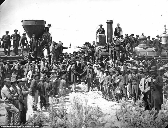 The continuous railway line was 1,912 miles long, and was built by Western Pacific Railroad Company, the Central Pacific Railroad Company (CPPR) from California, and the Union Pacific. It was officially opened on May 10, 1869, when CPPR president Leland Stanford drove the last spike into the line, pictured. A man stood on one of the trains can be seen bolding up a bottle of champagne in the background