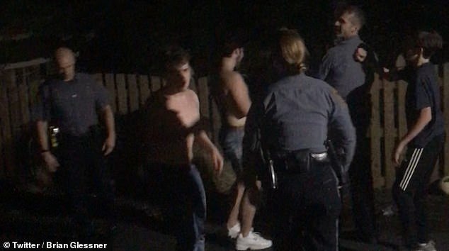 Brian Glessner, a senior at Glenn Allen High School in Henrico, Virginia, films the game which turns in to a 30 minute match as three officers battle three revelers
