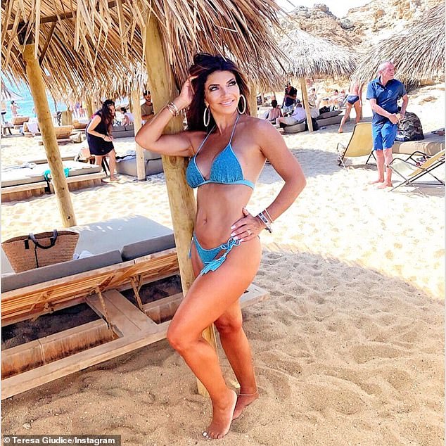 Also in blue: The Real Housewives Of New Jersey star's mother wore a very similar suit last year as she posed on a beach while on vacation proving once again that Gia is following in her famous mother's footsteps