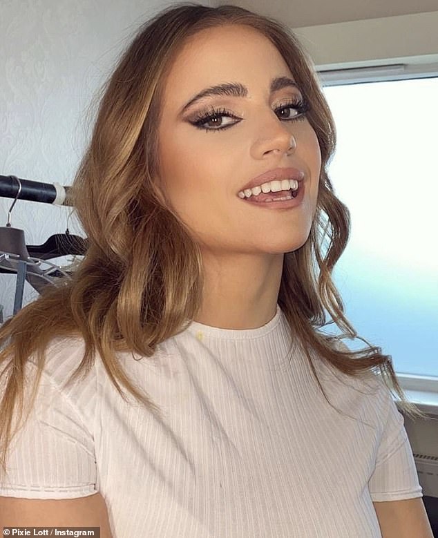 Beauty: Pixie's natural beauty was enhanced with heavy cat-eye makeup