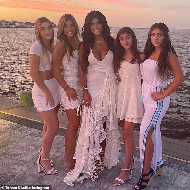 Gorgeous family: Teresa shared a sweet family portrait to her Instagram account this summer. The Real Housewives Of New Jersey star wore a plunging white dress as she posed with all four of her mini-me daughters on the Jersey Shore