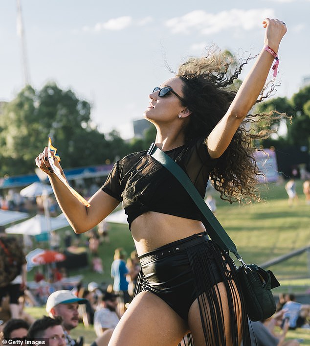 Casual contacts no longer exist, meaning anyone in a pub or other form of retail outlet at the same time as a positive case no longer has to isolate (pictured, a concert-goer in Melbourne)
