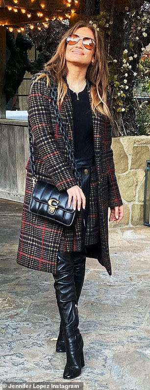 Pairing up: The On The Floor singer also rocked a skirt that matched her outerwear as well as a pair of knee-high boots