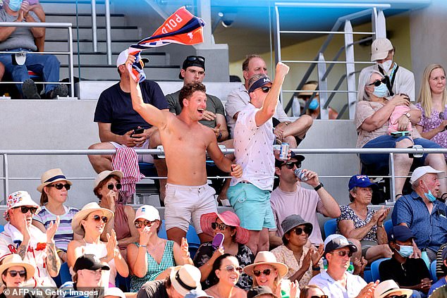 Despite being polar opposites, tennis stars Nick Kyrgios and Ash Barty are both crowd favourites with Aussie fans (pictured, fans cheering on Kyrgios on Sunday)