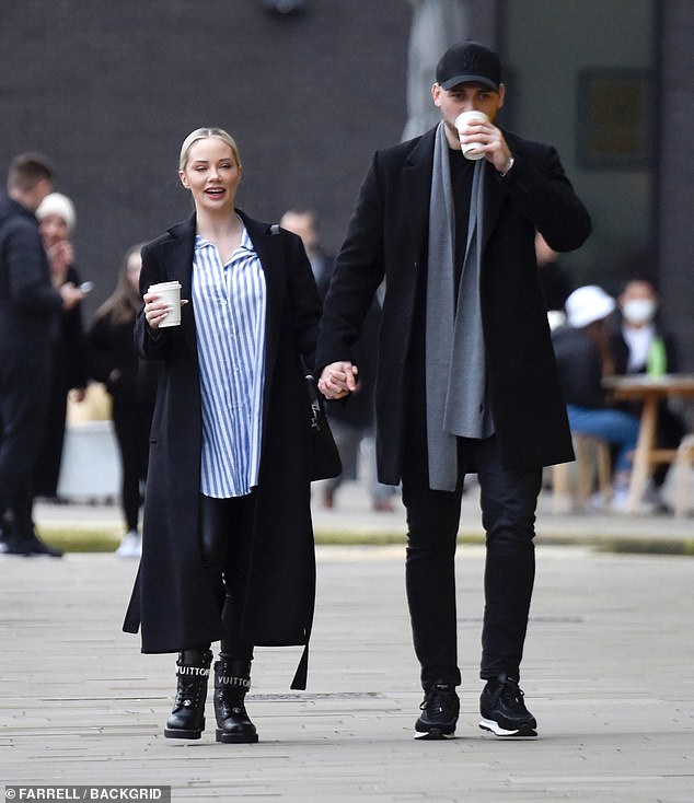 Pricey: The reality star topped the outfit with a black coat and finished the ensemble with a pair of pricey Louis Vuitton boots