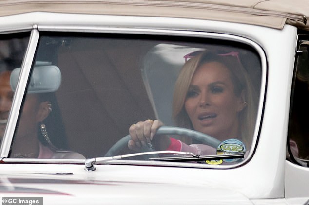 Cruising: Amanda got behind the wheel of a white 1948 Ford De Luxe convertible