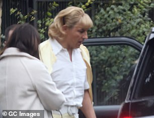 Uncanny! David was ready for a day at Rydell High School in a signature Fifties style A-line skirt, sweet collared white shirt and cropped lemon cardigan
