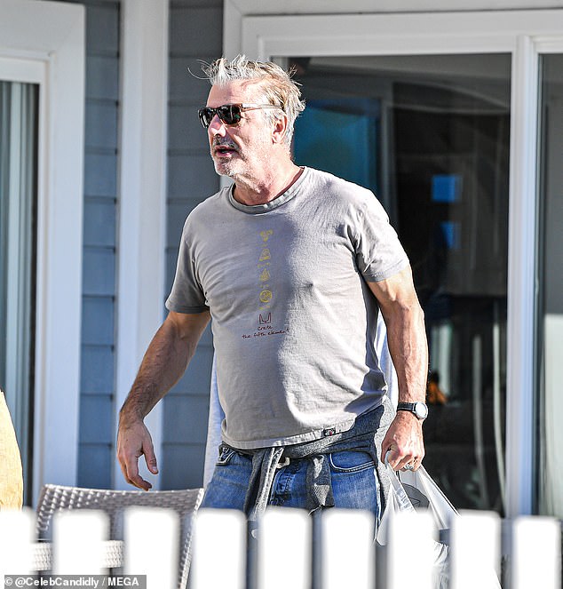 Downtime: The 67-year-old wore a wrinkled grey T-shirt as he headed out of a daytime get together with some friends, appearing unbothered by the scandal currently plaguing him