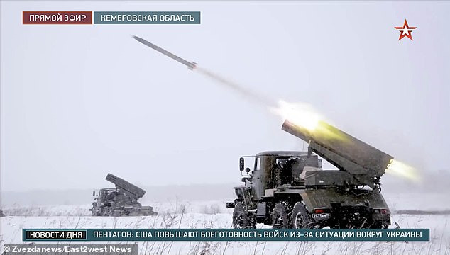 Russian forces are pictured launching rockets during their artillery drills in the Kemerovo region