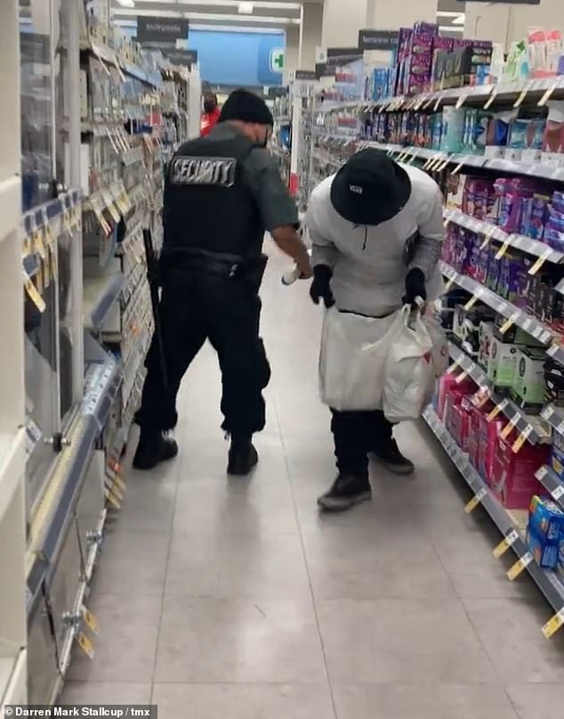 The thief drops products from his bags, sending the guard to retrieve them while he gets away