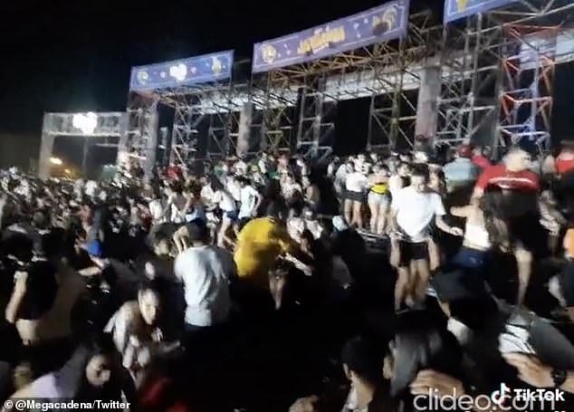 Concertgoers storm out of the Ja’umina Fest in San Bernandino, Paraguay, after shots were fired
