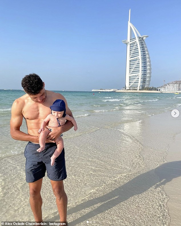 Fun in the sun: A day prior, the sportsman shared a picture of himself with Axel as the father-son duo played on the sandy beach together