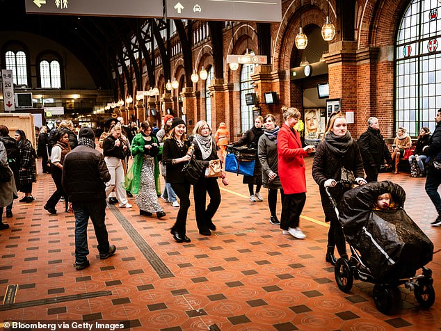Commuters are seen at the Central railway station in Copenhagen, Denmark, after most Covid restrictions in the country had been ditched, despite rising case numbers