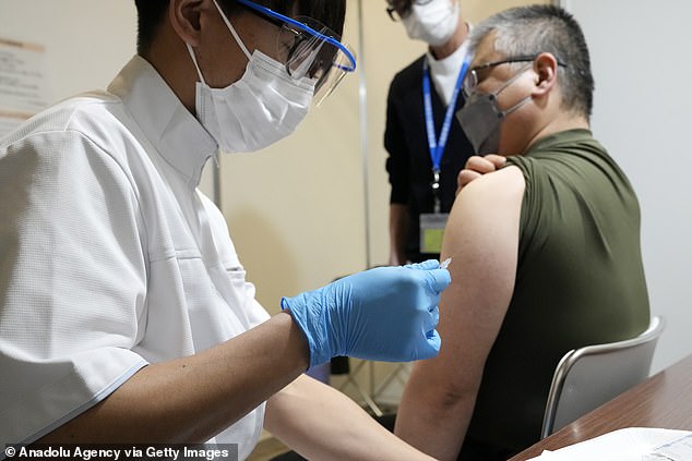 A man receives a third dose of a Covid-19 vaccine in Japan during the nation's current Omicron surge