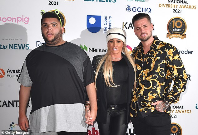 Pose: Having covered her two black eyes with a heavy helping of concealer, she prepared to hit the red carpet in Liverpool despite her head being tightly bound with medical dressings