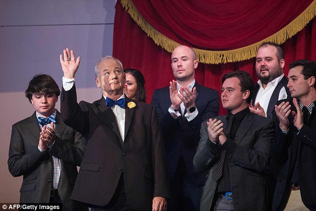 Bill Murray squirmed as dozens of stars praised the famously private actor as he was honored with the nation's top prize for comedy on Sunday