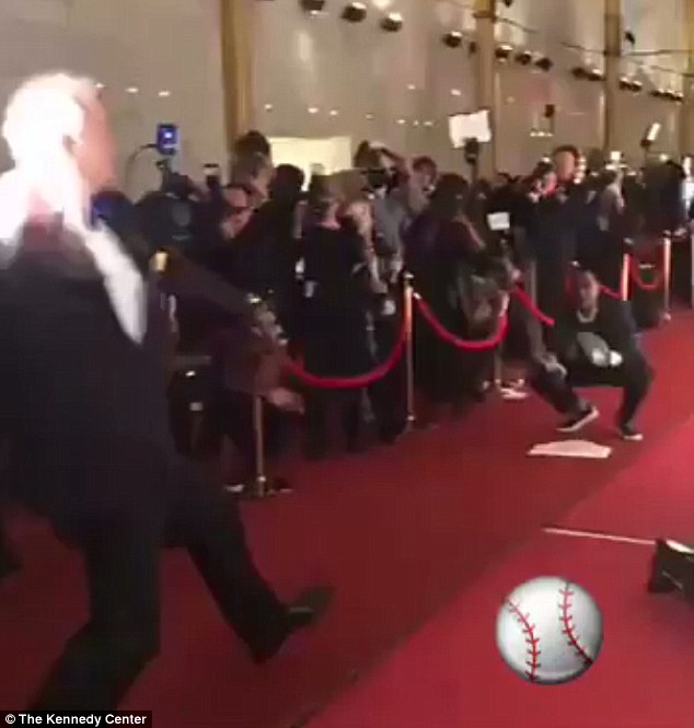 Video shows the 66-year-old comedian throwing a baseball down the red carpet after a reporter challenged him 