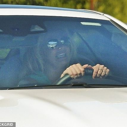 Britney Spears is spotted driving with mystery friend… as it’s claimed she ‘does what she wants’